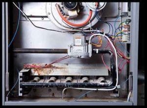 Furnace repair in Ocean County, Close-up picture of the inside of a gas furnace showing parts