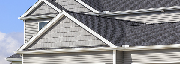 Old Bridge gutter cleaning, horizontal photo of white gutters on home with grey siding